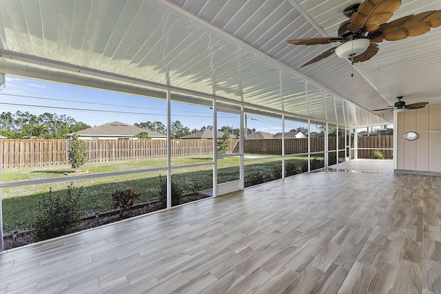 unfurnished sunroom featuring plenty of natural light