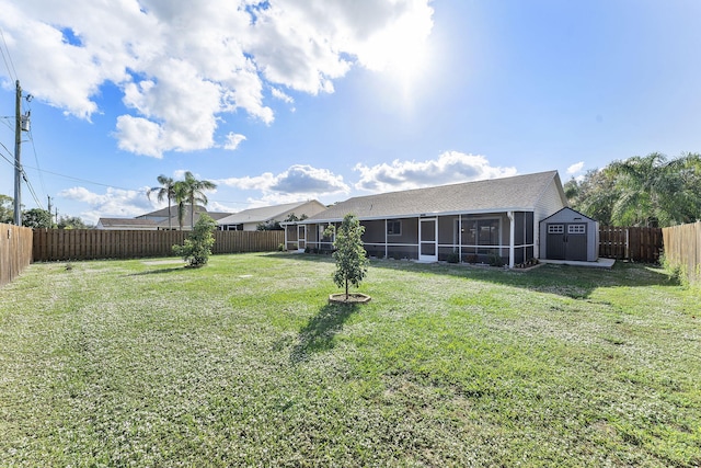 view of yard featuring a storage shed and a sunroom