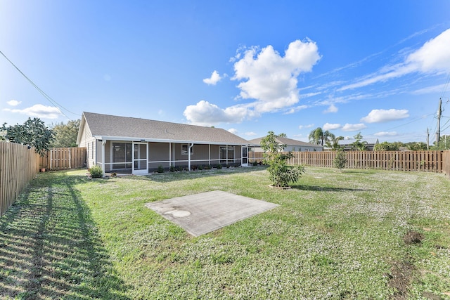 view of yard featuring a sunroom