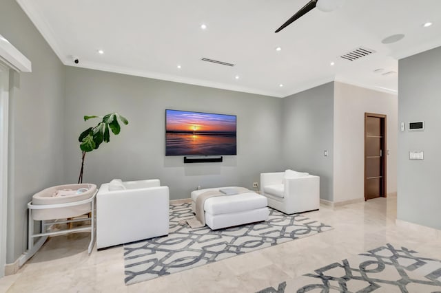 living room with ceiling fan and crown molding