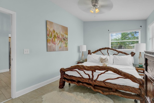 tiled bedroom with ceiling fan