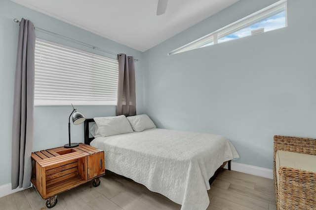 bedroom featuring ceiling fan and light hardwood / wood-style floors