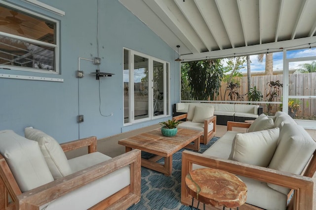 sunroom / solarium featuring lofted ceiling