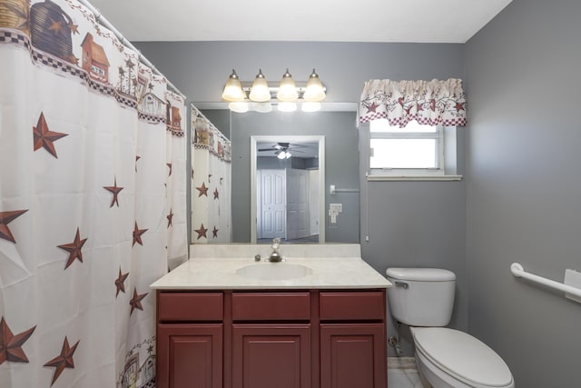 bathroom featuring ceiling fan, toilet, and vanity