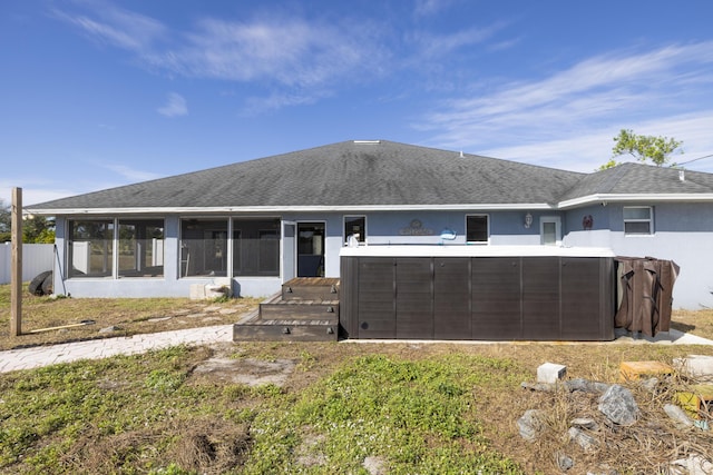 back of property featuring a sunroom