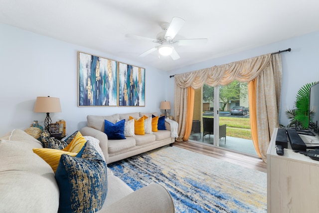 living room with hardwood / wood-style flooring and ceiling fan