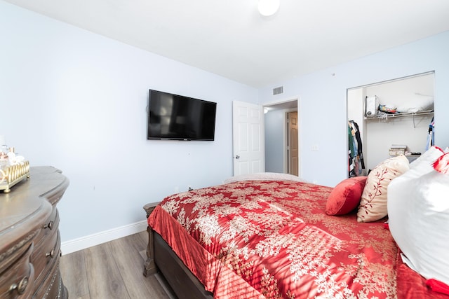 bedroom featuring hardwood / wood-style flooring and a closet