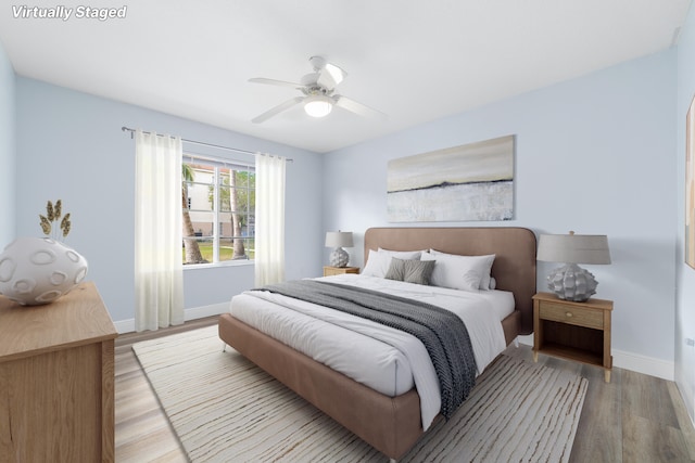 bedroom featuring ceiling fan and light wood-type flooring