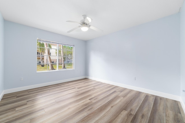 spare room with ceiling fan and light hardwood / wood-style floors