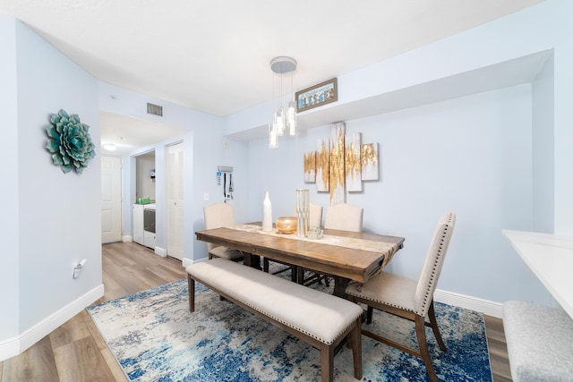 dining room with light hardwood / wood-style flooring