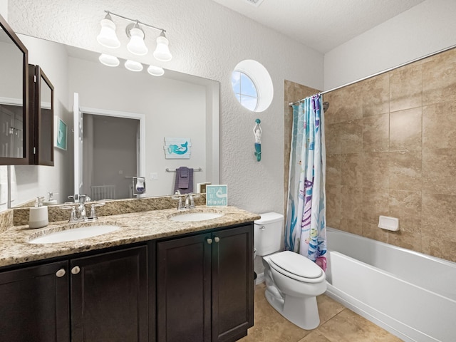 full bathroom with shower / tub combo with curtain, tile patterned flooring, vanity, toilet, and a textured ceiling