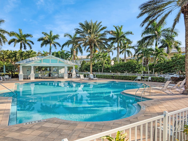 view of swimming pool with a gazebo and a patio area