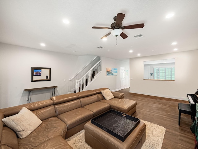 living room featuring hardwood / wood-style flooring and ceiling fan