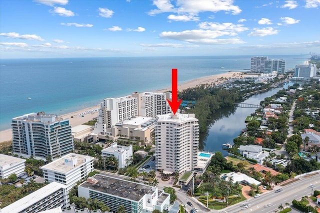 aerial view with a water view and a view of the beach