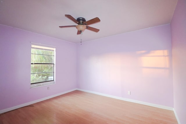 empty room featuring ceiling fan and light hardwood / wood-style flooring