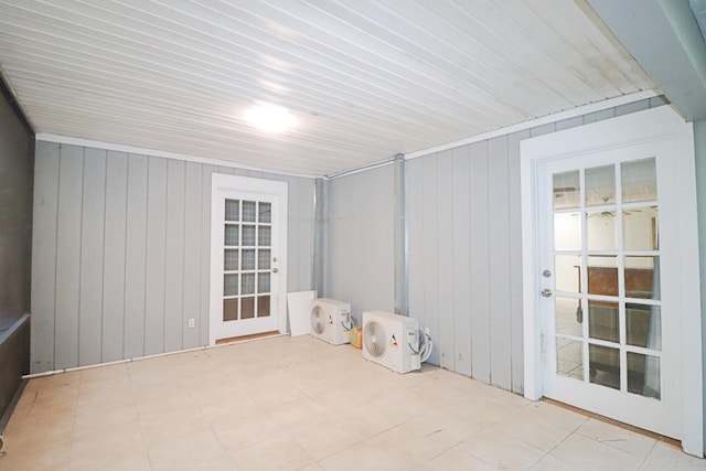 empty room featuring wooden walls