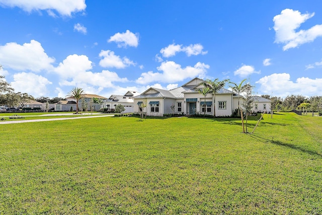 ranch-style home featuring a front lawn