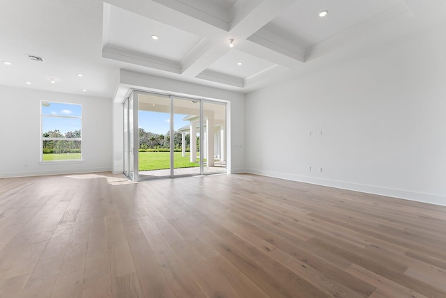 unfurnished room featuring hardwood / wood-style floors, beamed ceiling, and coffered ceiling