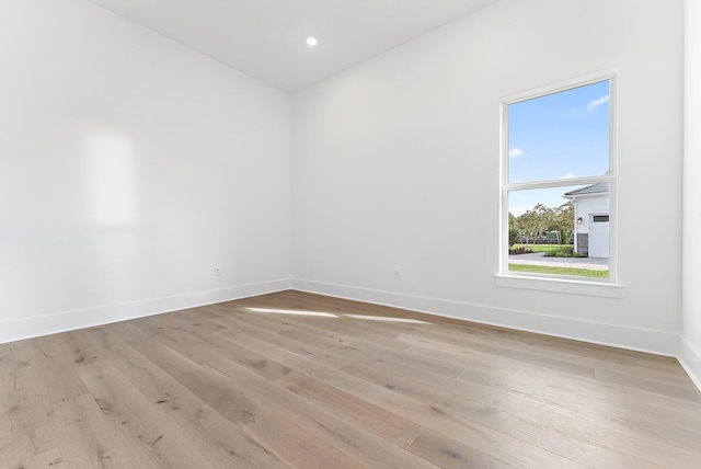 empty room with light hardwood / wood-style floors