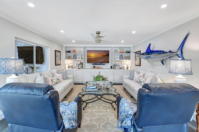 living room featuring built in shelves, ceiling fan, and crown molding