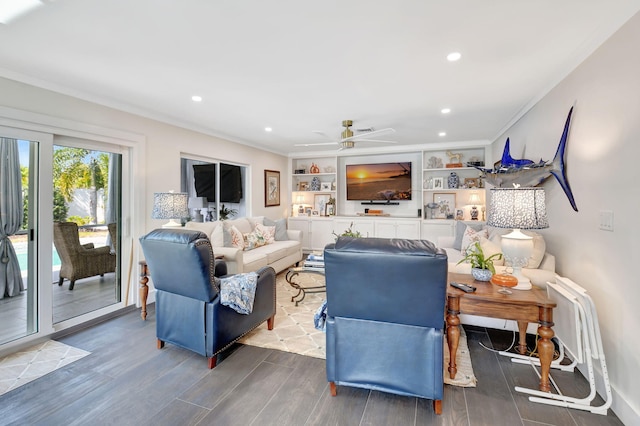 living room featuring ceiling fan, built in features, and crown molding