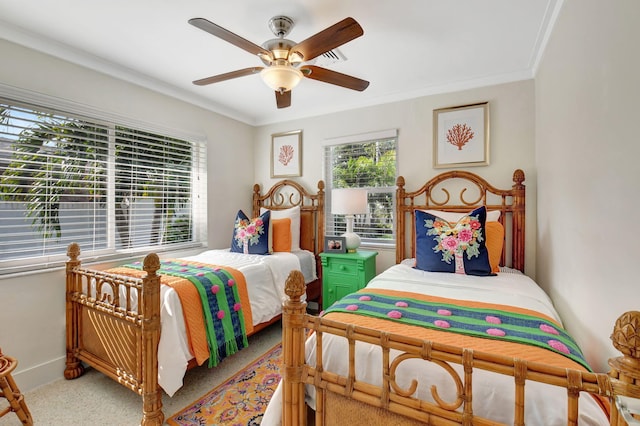 bedroom with ceiling fan and ornamental molding