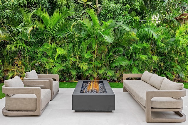 view of patio / terrace featuring an outdoor fire pit