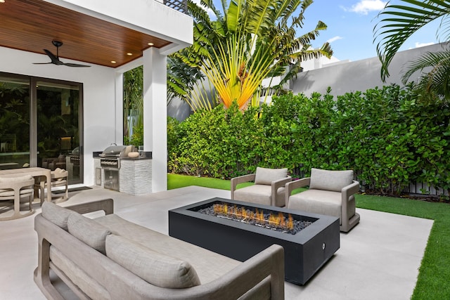 view of patio / terrace featuring a fire pit, area for grilling, and ceiling fan