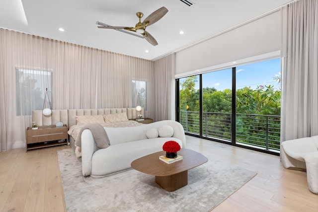 bedroom with access to outside, light wood-type flooring, and ceiling fan