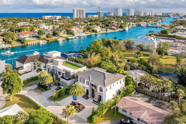 birds eye view of property with a water view