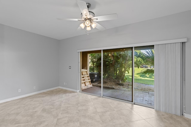 spare room with light tile patterned flooring and ceiling fan