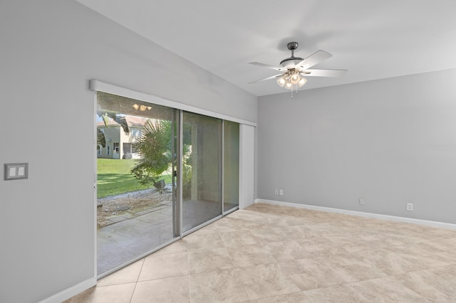 spare room featuring light tile patterned floors and ceiling fan