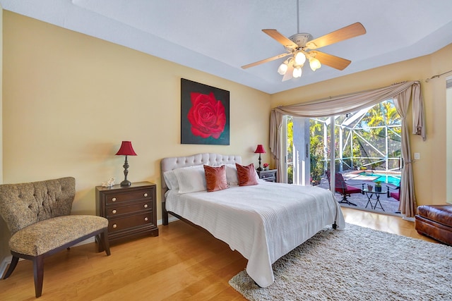 bedroom featuring ceiling fan, access to outside, and light wood-type flooring