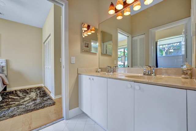 bathroom with tile patterned floors and vanity