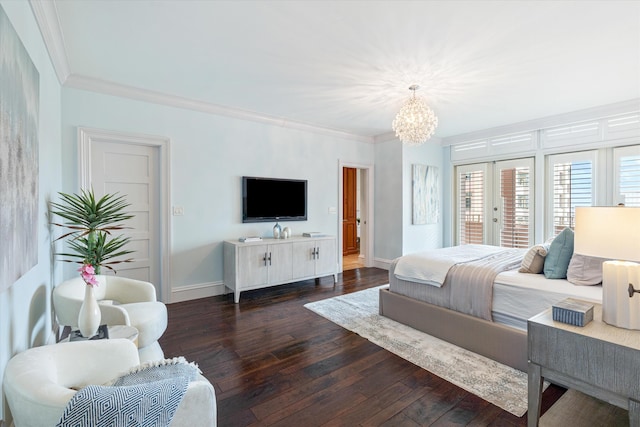 bedroom with dark wood-type flooring, access to outside, an inviting chandelier, french doors, and ornamental molding