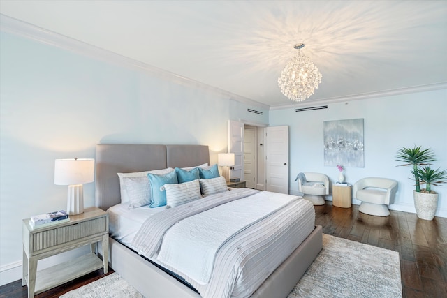 bedroom featuring crown molding, dark wood-type flooring, and a notable chandelier