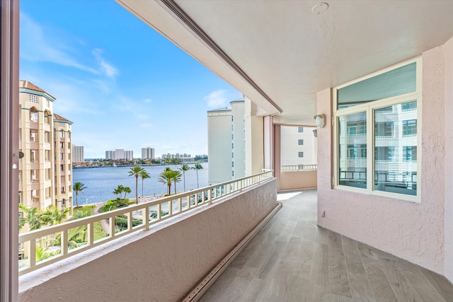 balcony featuring a water view