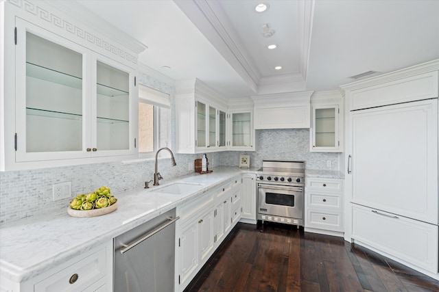 kitchen featuring crown molding, sink, appliances with stainless steel finishes, dark hardwood / wood-style flooring, and white cabinetry