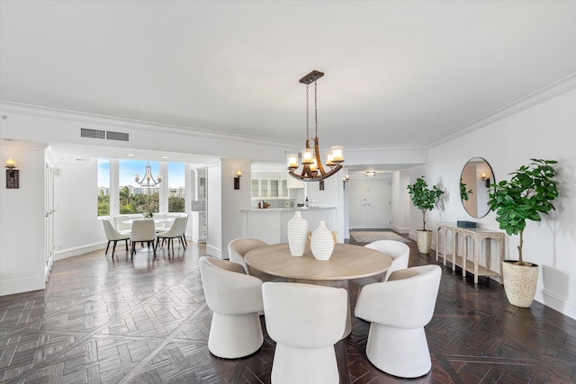 dining room featuring a chandelier, dark parquet floors, and crown molding