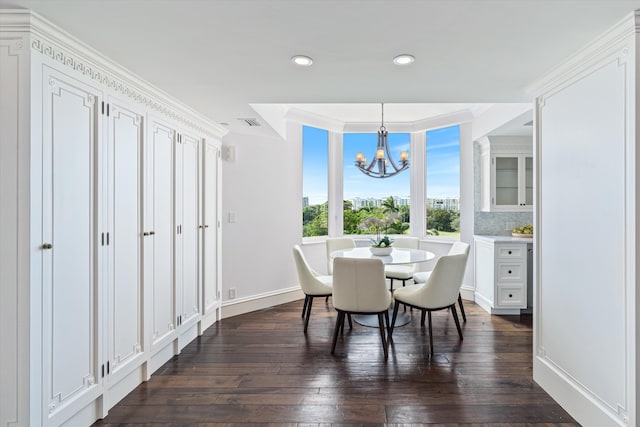 dining room with a chandelier and dark wood-type flooring