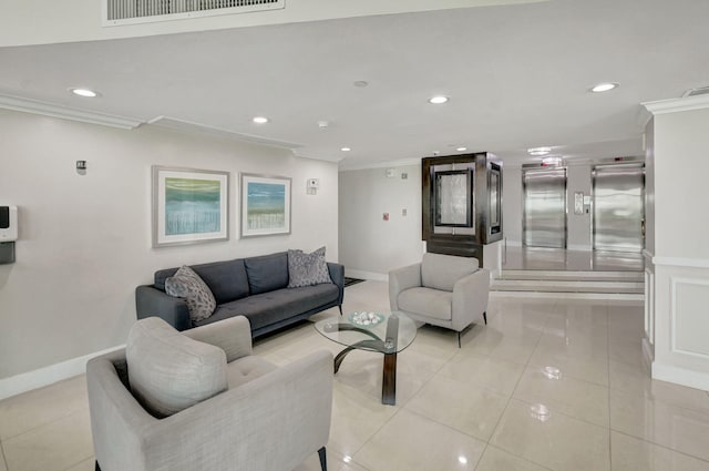 living room with elevator, light tile patterned flooring, and ornamental molding