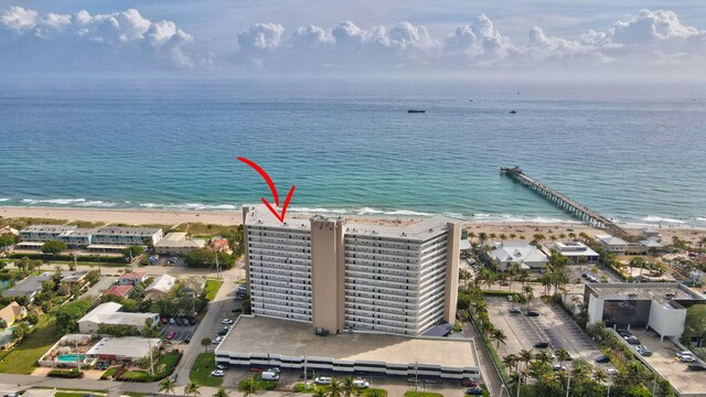 bird's eye view with a view of the beach and a water view