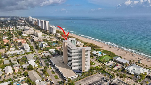 aerial view with a water view and a view of the beach