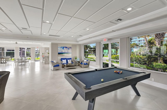 rec room featuring french doors, ornamental molding, a tray ceiling, light tile patterned floors, and pool table