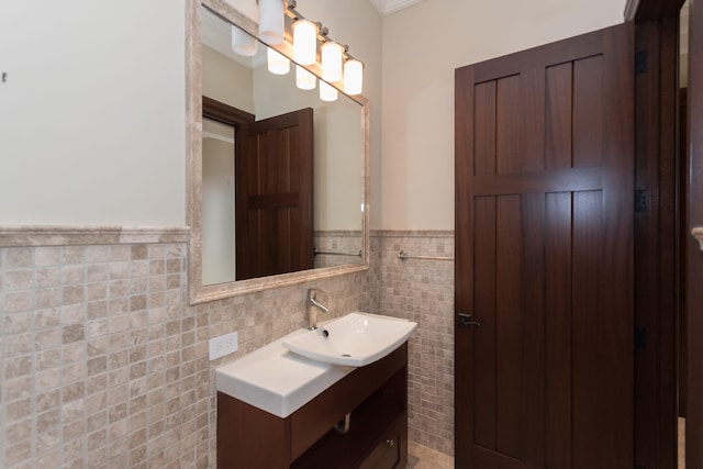 bathroom featuring vanity and tile walls