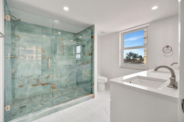 bathroom featuring a marble finish shower, marble finish floor, vanity, and toilet