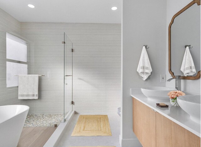 kitchen with white cabinetry, backsplash, and appliances with stainless steel finishes