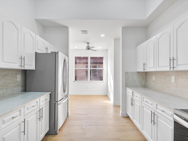 unfurnished room with light hardwood / wood-style flooring