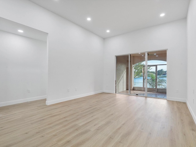 spare room with light hardwood / wood-style flooring