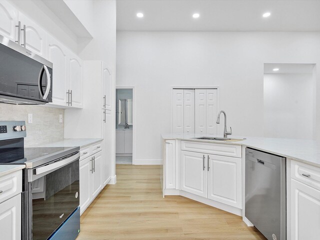 unfurnished living room featuring light hardwood / wood-style floors